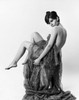 Portrait of a young woman sitting on a stool Poster Print - Item # VARSAL25542174