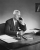 Businessman talking on the telephone in an office Poster Print - Item # VARSAL25527995