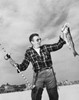 Young man holding fish and fishing rod Poster Print - Item # VARSAL25521061