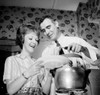 Man putting spaghetti on woman's plate  low angle view Poster Print - Item # VARSAL255417785