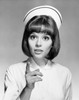 Portrait of a female nurse pointing with her finger Poster Print - Item # VARSAL25526292