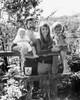 Portrait of a mature couple smiling with their son and daughter Poster Print - Item # VARSAL2554383