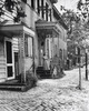 Woman standing on the porch of a house  Savannah  Georgia  USA Poster Print - Item # VARSAL25545891