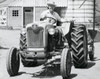 Portrait of a mid adult man sitting on a tractor Poster Print - Item # VARSAL2554210