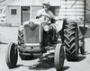 Portrait of a mid adult man sitting on a tractor Poster Print - Item # VARSAL2554210
