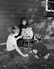 Boys and girl preparing pumpkin for Halloween party Poster Print - Item # VARSAL255423024