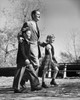 Mid adult man walking with his two children Poster Print - Item # VARSAL25519469