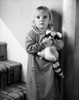 Portrait of a girl standing on a staircase with her stuffed toy Poster Print - Item # VARSAL2553293