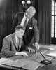 Two businessmen discussing blueprint in office Poster Print - Item # VARSAL25547978