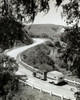High angle view of a camper attached to a truck moving on a road  Solvang  California  USA Poster Print - Item # VARSAL2553697