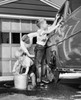 Mid adult man with his two sons washing a car Poster Print - Item # VARSAL25540448