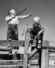 Low angle view of two boys holding slingshots Poster Print - Item # VARSAL25516273