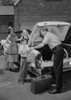 Parents with children loading suitcases into car Poster Print - Item # VARSAL255419091