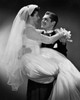 Groom carrying his bride and smiling Poster Print - Item # VARSAL255756B