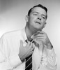 Businessman wiping neck  studio shot Poster Print - Item # VARSAL255416554