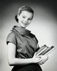 Teenage girl carrying books Poster Print - Item # VARSAL2553914B
