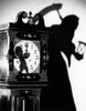 Close-up of a clock with the shadow of a person carrying a scythe Poster Print - Item # VARSAL255403