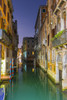 Turquoise water in a narrow canal between buildings at dusk; Venice, Veneto, Italy PosterPrint - Item # VARDPI2413842