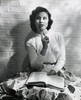 Close-up of a teenage girl leaning against a wall and holding a book Poster Print - Item # VARSAL2554116