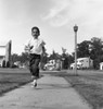 Boy running on pavement Poster Print - Item # VARSAL255418303