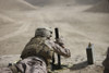 U.S. Marine clears a PK 7.62mm general-purpose machine gun after firing it at old russian APCs in a wadi near Kunduz, Afghanistan Poster Print - Item # VARPSTTMO100360M