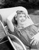 Attractive young woman resting on sun lounger Poster Print - Item # VARSAL255421115