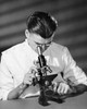 Scientist looking through a microscope in a laboratory Poster Print - Item # VARSAL2552956