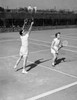 Young couple playing doubles tennis Poster Print - Item # VARSAL255420299