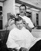 Hairdresser massaging hair of a mid adult man Poster Print - Item # VARSAL2554313