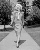 Young elegant woman walking down street Poster Print - Item # VARSAL255422357