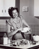 Portrait of a mid adult woman preparing food Poster Print - Item # VARSAL2552855
