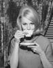 Portrait of a young woman drinking from a tea cup Poster Print - Item # VARSAL25512656A