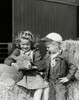 Girl and her brother looking at a lamb Poster Print - Item # VARSAL25516633