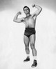 Portrait of a young man flexing his muscles Poster Print - Item # VARSAL25523753