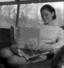 Young woman watching gift Poster Print - Item # VARSAL255420965