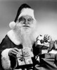 Portrait of Santa Claus holding Christmas presents and smiling Poster Print - Item # VARSAL25526724 Portrait of Santa Claus holding Christmas presents and smiling Poster Print - Item # VARSAL25526724