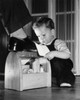 Son shining his father's shoe Poster Print - Item # VARSAL2553322