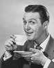 Portrait of mature man drinking from coffee cup Poster Print - Item # VARSAL2553038