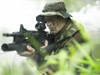 U.S. Special Forces soldier patrols through tall grass during combat Poster Print - Item # VARPSTTWE300018M