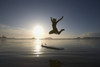 Silhouette Of Female Surfer Jumping For Joy; Chesterman Beach Tofino Vancouver Island British Columbia Canada PosterPrint - Item # VARDPI1938904