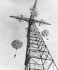 Low angle view of army soldiers parachuting from a tower at a training center  Fort Benning South  Georgia  USA  24 September  1949 Poster Print - Item # VARSAL25543821