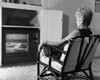 Rear view of a mature woman watching television Poster Print - Item # VARSAL25511278