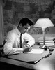 Young man writing on a sheet of paper Poster Print - Item # VARSAL25518345