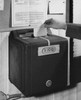 Close-up of a person's hand inserting time card in a time clock Poster Print - Item # VARSAL25549808