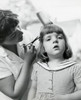 Side profile of a mother cutting her daughter's hair Poster Print - Item # VARSAL25519768