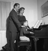 Parents singing with son playing piano Poster Print - Item # VARSAL255418072