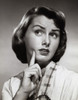 Close-up of a young woman with her finger on her face Poster Print - Item # VARSAL25510733