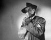 Portrait of a mid adult man smoking a cigarette Poster Print - Item # VARSAL25547708
