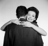 Studio portrait of woman embracing husband Poster Print - Item # VARSAL255417660