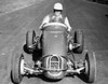 Mid adult man driving a race car on a motor racing track Poster Print - Item # VARSAL2555565